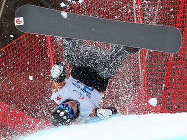 Finland's Matti Suur-Hamar takes a fall during the men's Para Snowboard Cross event at the 2014 Winter Paralympics in Sochi, Russia on March 14, 2014.