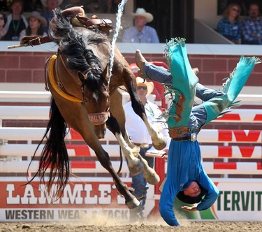 Josh Davison from Miles City, Montana is bucked off a horse on his re-ride during the Novice Saddle Bronc at the Calgary Stampede on July 11, 2014.