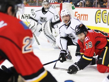 The Calgary Flames David Jones and Kings Alec Martinez fight for position during first period NHL action in Calgary.