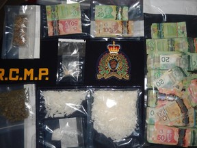 RCMP in Calgary seized one pound of crystal methamphetamine and about $120,000 in Canadian currency on Dec. 9, 2014, in a drug trafficking investigation. Three people have been charged.