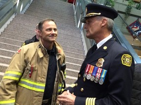 New Calgary Fire Chief Steve Dongworth greets colleagues after being introduced to city council Monday. He begins on the job January 1.