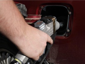 Calgary, Alberta-20081025 - Calgary motorists are happily filling up their cars as prices at some gas stations have plummeted to the low 90 cent mark around Calgary on October 25th, 2008. Photo by Adrian Shellard/Calgary Herald (For City section story by TBA) NA