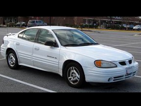 Police are looking for a vehicle described as a white, 1996-1998, Pontiac Grand Am, similar to the vehicle pictured here.  The vehicle will have substantial damage to its front end and possibly the windshield.