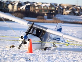 A small single-engine plane sits idle after crashing through the ice of Chestermere Lake on December 3, 2014. Nobody was injured in the crash.