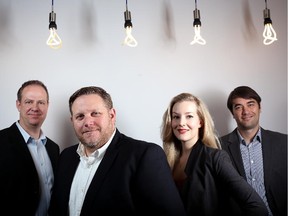 LPi Group members from left to right; Craig Lindsay, president, Ken Youngberg, managing director, Erin Henry, director client services and Brian Clegg, digital director, pose for a photo at their office in Calgary, Alberta on December 14, 2013.