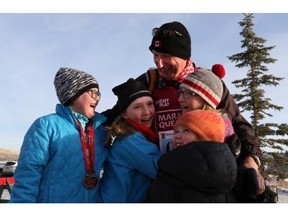 Martin Parnell finishes his last race for Right to Play in Cochrane, on December 31, 2014.