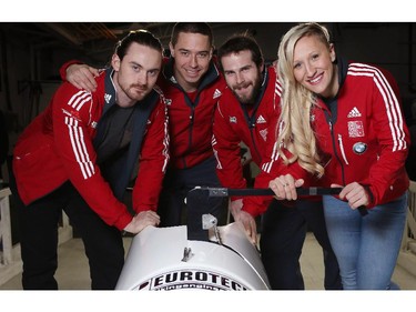 Kaillie Humphries, right, poses for a photo at the Ice House in Calgary, with her team from left, Dan Dale, Joe Nemet and DJ McClelland, before they race together this weekend on the World cup for the first time.