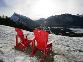 Parks Canada placed these two red chairs in the meadow on the Mount Norquay Road looking over Banff and Mt. Rundle.