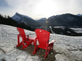 Parks Canada placed these two red chairs in the meadow on the Mount Norquay Road looking over Banff and Mt. Rundle. Reader says this junk litters up the landscape.