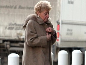 Heather Wilson Duncan, accused of murdering her husband, walks inside to the courthouse on November 18, 2013.