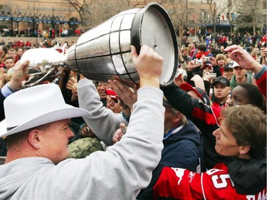 Calgary Stampeders offensive lineman Rob Lazeo carries the cup to the crowd at the Stampeder's Grey Cup celebration at Olympic Plaza in Calgary Tuesday, November 25, 2008.