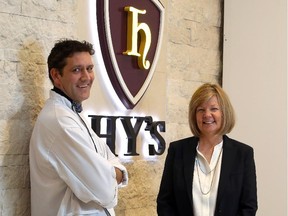 Andrew Keen, chef, and Barb Steen, general manager stand outside of Hy's Steakhouse in downtown Calgary on Dec. 1, 2014.