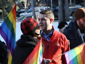 The LGBTQ community rallies against Bill 10 outside McDougall Centre in Calgary on Dec. 4, 2014.