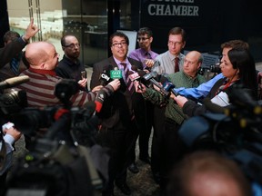 Calgary Mayor Naheed Nenshi scrums with reporters during budget deliberations recently. Nenshi says the municipality is one of the most cost efficient in the country.