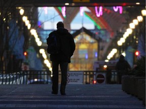 Christmas can be especially lonely for the homeless. A man who said he was a resident at the Calgary Drop-In and Rehab Centre walks along Stephen Avenue in downtown Calgary at dusk.