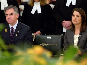 Alberta Premier Jim Prentice (left) and Alberta Wildrose Leader Danielle Smith (right) attended a Holodomor commemoration ceremony at the Alberta legislature on Nov. 25, 2014.