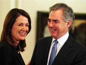 Danielle Smith and Premier Jim Prentice speak about her and eight other Wildrose caucus members crossing the floor to the Progressive Conservative caucus, at the at Government House in Edmonton, December 17, 2014.