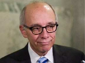 Alberta Health Minister Stephen Mandel speaks to the media at the Alberta Legislature in Edmonton on November 26, 2014.