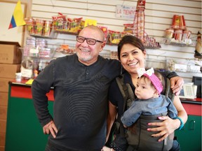 Jose Luis Villatoro stands with employee Alondra Hernandez and her daughter Alondra in his La Tiendona Market part of the International Avenue BRZ in Calgary on Thursday November 20, 2014.