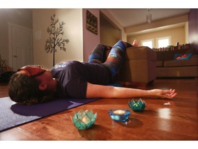 Gavin Young, Calgary Herald CALGARY, AB: NOVEMBER 19, 2014 - Yoga instructor Johanna Steinfeld demonstrates the savasana pose for her December yoga column. (Gavin Young/Calgary Herald) (For Real Life section story by Johanna Steinfeld) Trax#