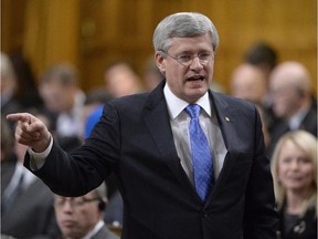 Prime Minister Stephen Harper answers a question in the House of Commons, Dec. 9, 2014.