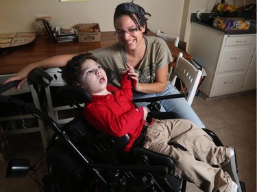 Nicole Daugherty and her three year old disabled son Izrahia can enjoy Christmas after the Alberta government reversed their decision to claw back her support payments, on December 24, 2014.