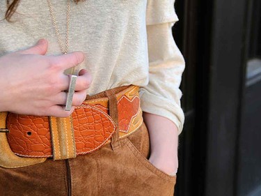 In this case, accessories—what a belt—really make the outfit.
