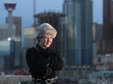 Karen Hines enjoys the view of downtown from near her Ramsay home Friday November 21, 2014. She is an acclaimed writer and performer in theatre who moved to Calgary a few years ago to be with her partner.