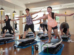 Jenn Pierce, Calgary Herald Calgary, AB; JUNE 23, 2014  -- A Surfset class hangs ten at Studio Revolution in Calgary on Monday June 23, 2014. (Jenn Pierce/Calgary Herald) For City story by Jason van Rassel. Trax # 00056530A