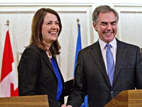 Former Wildrose Leader Danielle Smith praises Alberta Premier Jim Prentice on Dec. 17, 2014 when she defected to the Progressive Conservative party, saying he is a fiscal conservative. However, that declaration is premature, writes the Herald editorial board.