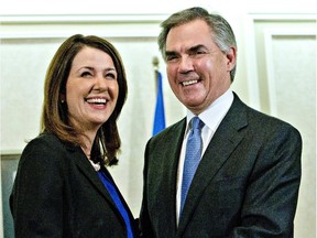 Alberta Premier Jim Prentice and former Wildrose Leader Danielle Smith are all smiles Wednesday after announcing she and eight of her MLAs have joined the PC caucus.