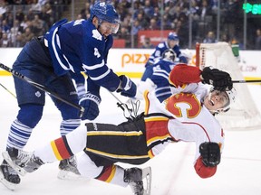 Toronto Maple Leafs defenceman Cody Franson  hits Calgary Flames forward Johnny Gaudreau during the third period on Tuesday night.