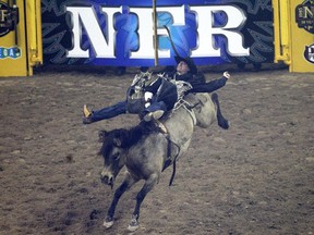 Jake Vold competes in bareback riding during the Wrangler National Finals Rodeo in Las Vegas.