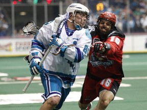 Calgary's Mike Carnegie battles Rochester's Cody Jamieson during the 2014 Champion's Cup final in Rochester N.Y. last May. After losing the title game, the Riggers are motivated and hungry entering the 2015 National Lacrosse League season.