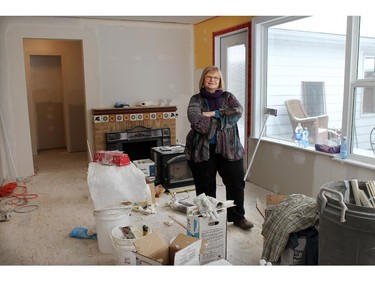 APRIL 20, 2014  --Leslie Lambert in the room that W.O. Mitchell used to write in on April 16th 2014. She has been struggling to save her High River home, which was once owned by W.O. Mitchell, since the floods 10 months ago. A NGO came forward to do the work for her, making it possible to save the home.