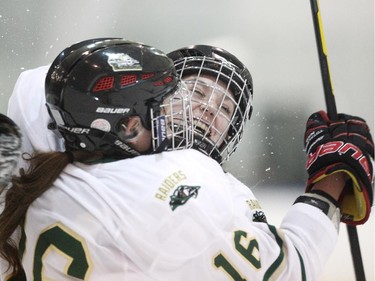 Rocky Mountain Raiders forwards Hailey McCallum, right, celebrated the goal by teammate Jenna Wasylik after scoring against the Battleford Sharks during their Mac's AAA Midget Female Division game at the Max Bell Arena on December 26, 2014.