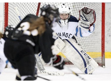 Edmonton Thunder goalie Tracie Kikuchi kept an eye on the play waiting for a shot by the Rocky Mountain Raiders during their Mac's AAA Midget Tournament at Max Bell Arena on December 27, 2014.