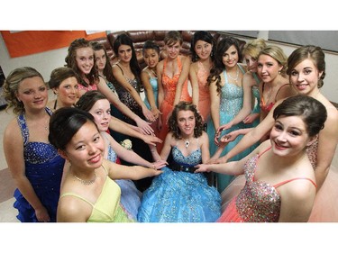 The girls share a moment just before heading out  for the judged dancing competition in the 48th Annual Queen's Ball in Nanton on December 5, 2014.  Grade 11 students from J.T. Foster high school spend 12 weeks learning proper etiquette and ballroom dancing. The day of the ball they go to a formal tea where they are judged on their social skills, do an interview with the judges as a couple and then are scored on their dance skills. They are also marked on a resume they submit to the judges and a fashion show in October.