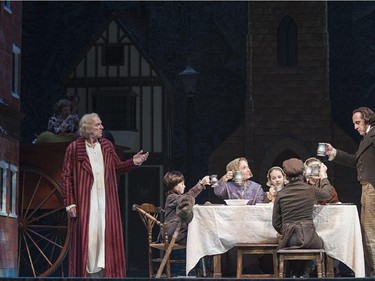 Photo by Jose Soriano
Stephen Hair (L) as Scrooge with the cast of A Christmas Carol at Theatre Calgary.