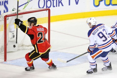 Calgary Flames Jiri Hudler ,left, celebrates his teammates overtime goal on the Edmonton Oilers during their game at the Scotiabank Saddledome in Calgary on December 31, 2014.