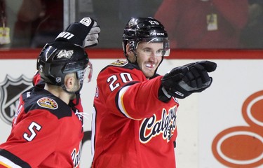 Calgary Flames Curtis Glencross, right, celebrates his goal on the Edmonton Oilers during third period action at the Scotiabank Saddledome in Calgary.