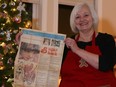 Ruth Woods with the gingerbread house recipe she clipped from the Calgary Herald in 1983, pictured in December 2014. Woods has been making gingerbread houses with kids from her community for over 30 years.