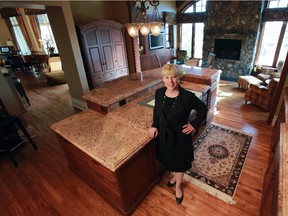 Realtor Rachelle Starnes in the kitchen of a $3.6 million listing in the Stone Pine community in Rocky View county just outside Calgary on April 23, 2014.