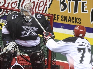 Calgary Roughnecks' Jeff Shattler fires one at Edmonton Rush's goalie Aaron Bold during exhibition game action at the Saddledome in Calgary, on December 20, 2014.