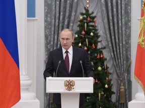 Russian President Vladimir Putin addresses the ceremony of conferring state awards and honorary titles at the Kremlin in Moscow on Dec. 22. Prime Minister Stephen Harper is right to impose further sanctions on Russia for its invasion of Ukraine.