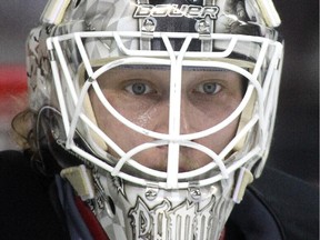 Calgary Flames goalie Karri Ramo keeps his eye on the puck during practice at the Saddledome on Monday . He will make his third-straight start, aiming for a third-straight shutout when the Flames host Arizona on Tuesday.