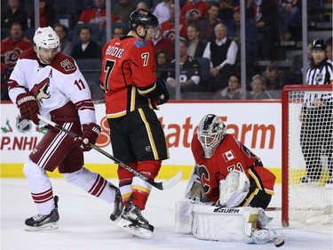 Karri Ramo of the Calgary Flames makes a toe save against the Arizona Coyotes at Scotiabank Saddledome in Calgary on Tuesday December 2, 2014.