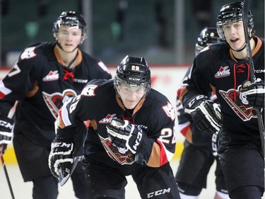 Elliott Peterson of the Calgary Hitmen skates to the bench after scoring on the Edmonton Oil Kings in the  first period at the Saddledome Friday night December 5, 2014.