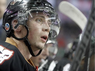 Connor Rankin of the Calgary Hitmen on the bench during the first period against the Edmonton Oil Kings at the Saddledome Friday night December 5, 2014.