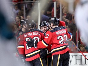 Calgary Flames Mark Giordano celebrates his goal on San Jose Sharks with teammates during their game at the Scotiabank Saddledome in Calgary on December 6, 2014.